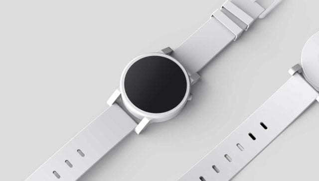 Eine Uhr mit schwarzem Zifferblatt und weißem Armband, die ein Alleinstellungsmerkmal darstellt.
